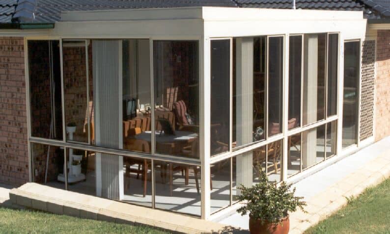 Brick Home with Glass Room Installed by HV Aluminium
