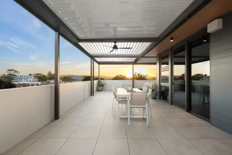 Balcony with closed louvre roof and ceiling fan installed.