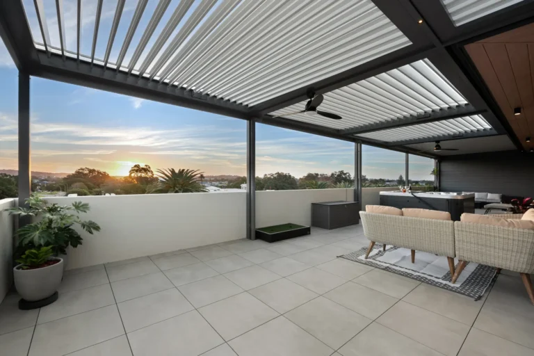 Aluminium louvre roof system with outdoor ceiling fan installed on high rise balcony in Newcastle area of NSW.