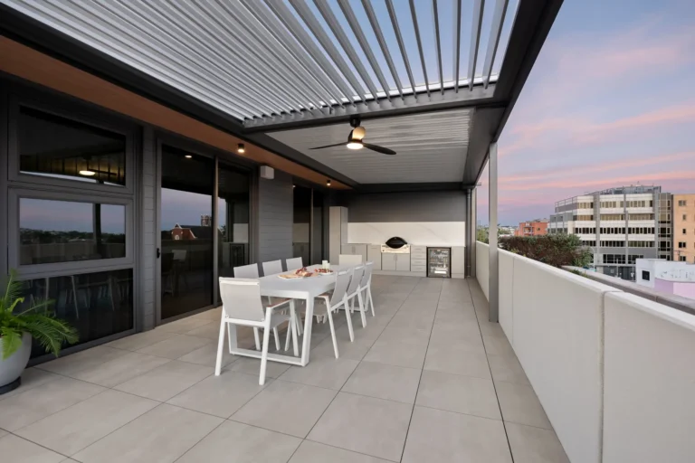 Dining setting under the louvre roof, installed on high rise balcony.