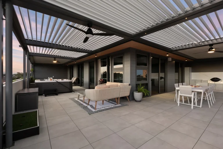Opening roof system with multiple louvre bays attached to the high rise building.