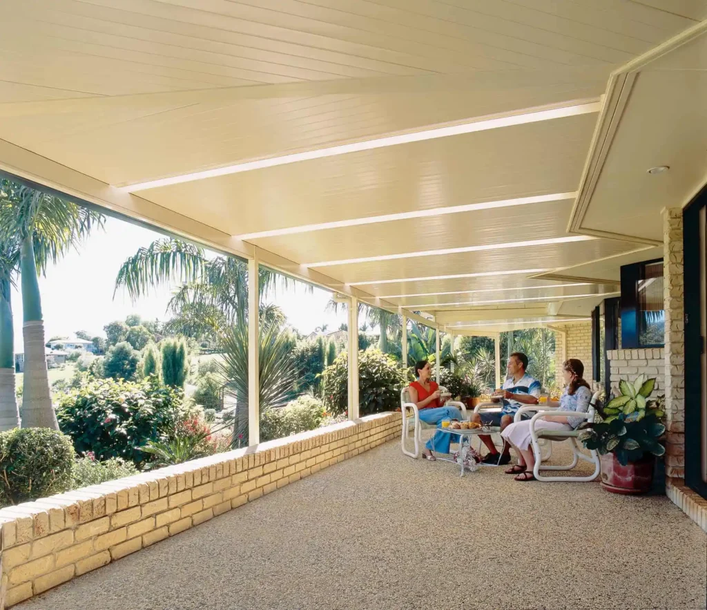 Outdoor enclosed room area with louvre roof.
