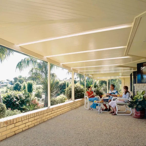 Outdoor enclosed room area with louvre roof.