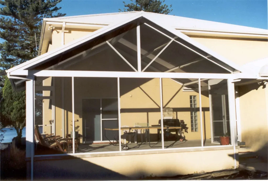 Screen room attached to back of house.